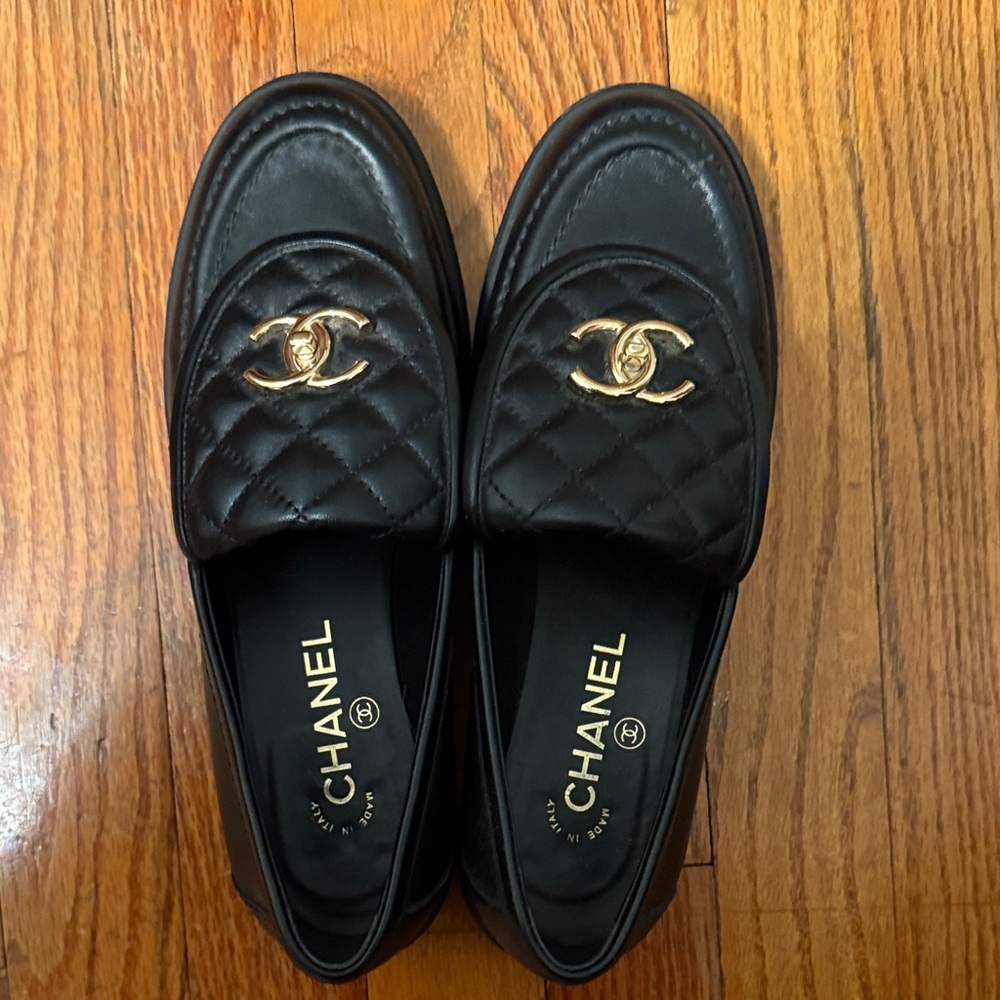 CHANEL Quilted Black Loafers with Gold Emblem